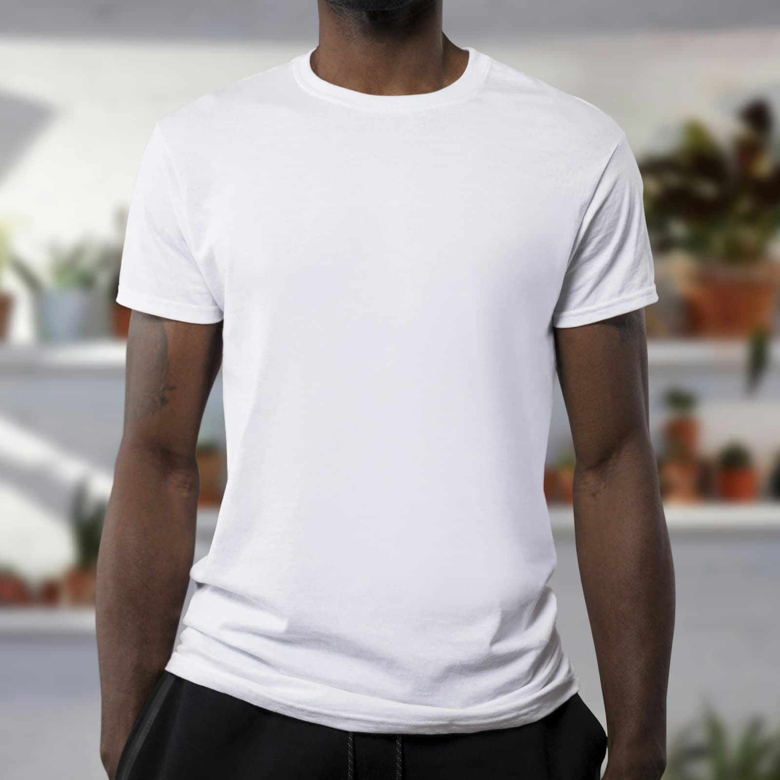 A plain white tee on a hanger